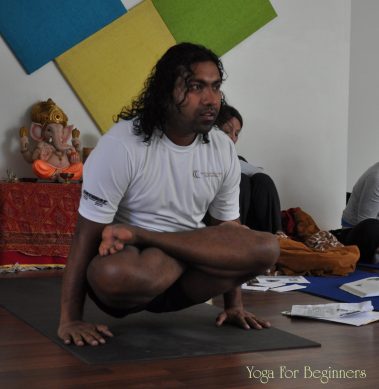 Flexible young man practicing yoga | Santosh Yoga Institute in Salt Lake City, UT