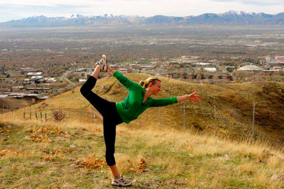 Flexible young woman practicing yoga outdoor | Santosh Yoga Institute in Salt Lake City, UT