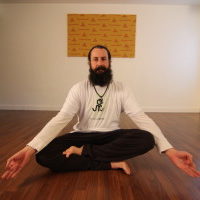 Young woman sitting doing pranayam meditation yoga | Santosh Yoga Institute in Salt Lake City, UT