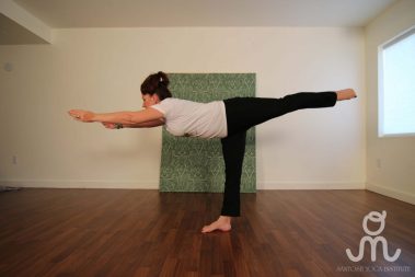 Flexible young woman practicing yoga | Santosh Yoga Institute in Salt Lake City, UT