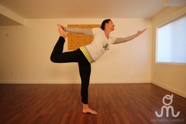 Flexible young woman practicing yoga | Santosh Yoga Institute in Salt Lake City, UT