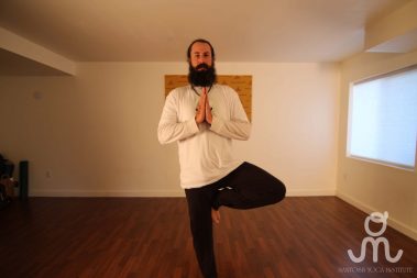 Flexible young man practicing yoga | Santosh Yoga Institute in Salt Lake City, UT