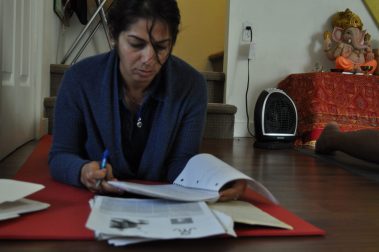 Young people sitting looking notebooks | Santosh Yoga Institute in Salt Lake City, UT