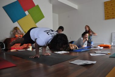 Flexible young man practicing yoga | Santosh Yoga Institute in Salt Lake City, UT