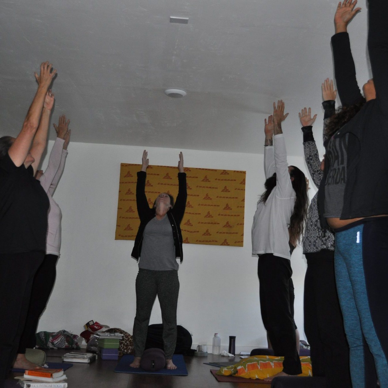 Group of young people practicing yoga | Santosh Yoga Institute in Salt Lake City, UT