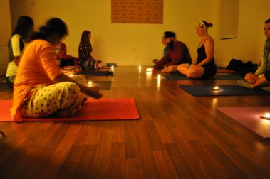 Group of People Doing Candle Meditation Yoga | Santosh Yoga Institute in Salt Lake City, UT