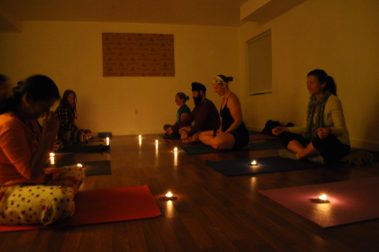 Group of People Doing Candle Meditation Yoga | Santosh Yoga Institute in Salt Lake City, UT