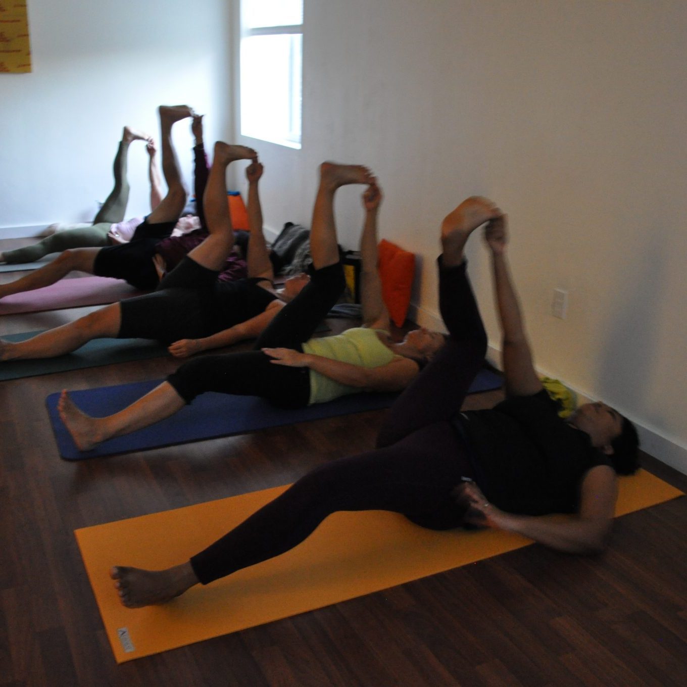 Group of young people practicing yoga | Santosh Yoga Institute in Salt Lake City, UT
