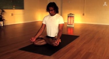 Young man doing meditation yoga | Santosh Yoga Institute in Salt Lake City, UT
