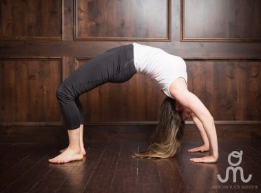 Flexible young woman practicing yoga | Santosh Yoga Institute in Salt Lake City, UT