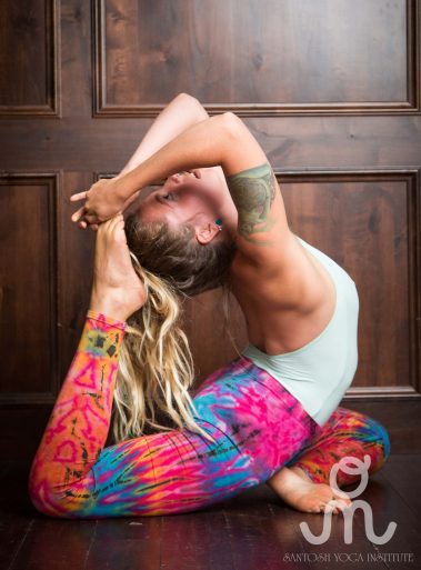 Flexible young woman practicing yoga | Santosh Yoga Institute in Salt Lake City, UT