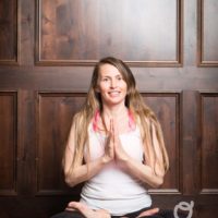 Young woman sitting doing meditation yoga | Santosh Yoga Institute in Salt Lake City, UT