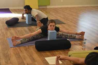 Flexible young people practicing yoga | Santosh Yoga Institute in Salt Lake City, UT
