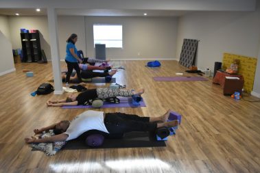 Flexible young people practicing yoga | Santosh Yoga Institute in Salt Lake City, UT
