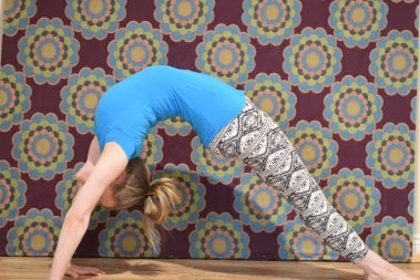 Flexible young woman practicing yoga | Santosh Yoga Institute in Salt Lake City, UT