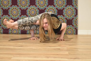 Flexible young woman practicing yoga | Santosh Yoga Institute in Salt Lake City, UT