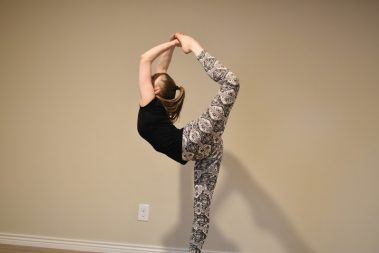 Flexible young woman practicing yoga | Santosh Yoga Institute in Salt Lake City, UT