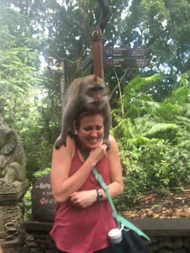 Young woman funny photo with monkey | Santosh Yoga Institute in Salt Lake City, UT