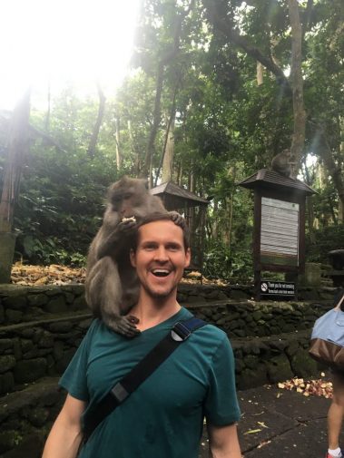 Young man funny photo with monkey | Santosh Yoga Institute in Salt Lake City, UT