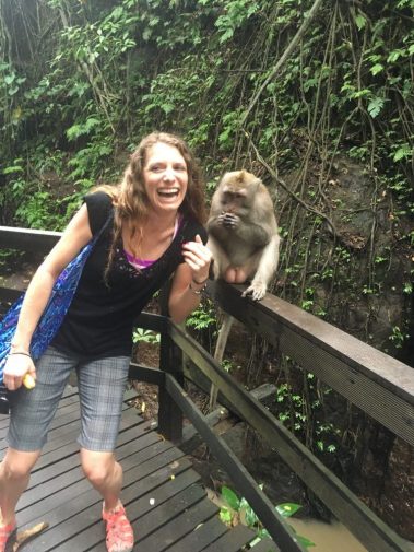 Young woman happy photo with monkey | Santosh Yoga Institute in Salt Lake City, UT