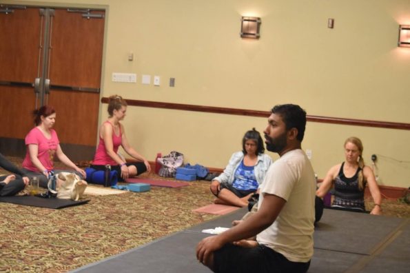 Group of people taking yoga sessions | Santosh Yoga Institute in Salt Lake City, UT
