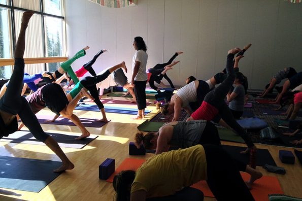 Group of people taking yoga training sessions | Santosh Yoga Institute in Salt Lake City, UT
