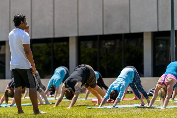 Group of people practicing yoga outdoors in Salt Lake City, UT | Santosh Yoga Institute