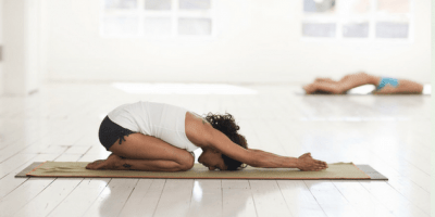 Young woman practicing yoga | Santosh Yoga Institute in Salt Lake City, UT