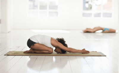 Young woman practicing yoga | Santosh Yoga Institute in Salt Lake City, UT