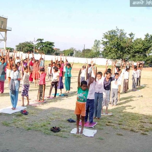 Group of children practicing yoga outdoors in Salt Lake City, UT | Santosh Yoga Institute