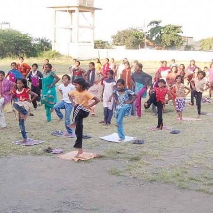 Group of children practicing yoga outdoors in Salt Lake City, UT | Santosh Yoga Institute