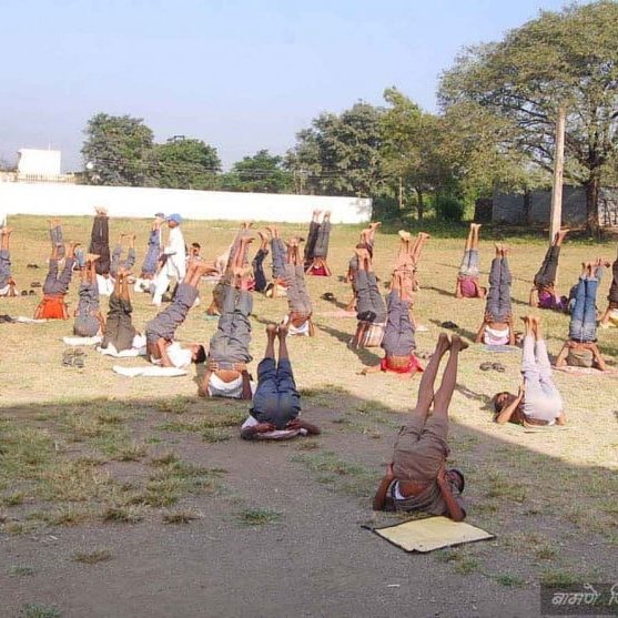 Group of people practicing yoga outdoors in Salt Lake City, UT | Santosh Yoga Institute