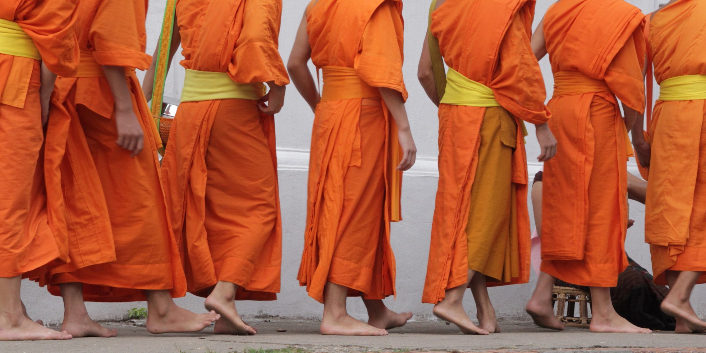 A group of young Buddhist monks is walking | Santosh Yoga Institute in Salt Lake City, UT