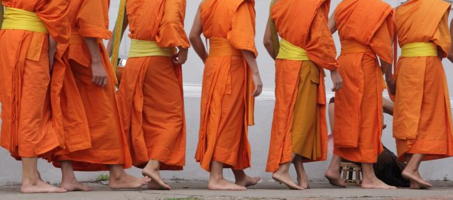 A group of young Buddhist monks is walking | Santosh Yoga Institute in Salt Lake City, UT