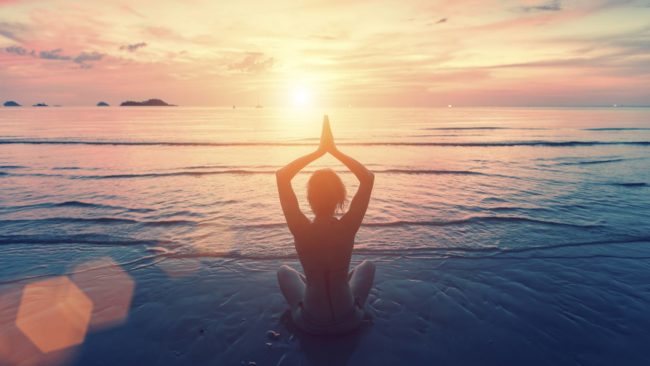 Woman yoga photo on a beautiful beach in Salt Lake City, UT | Santosh Yoga Institute