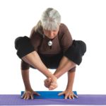 Lady doing yoga using Foam Yoga Wedge in Salt Lake City, UT | Santosh Yoga Institute