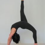 Woman doing Eka Pada Urdhva Dhanurasana Asana in Salt Lake City, UT | Santosh Yoga Institute