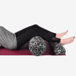 Woman legs on Pranayama yoga-bolster in Salt Lake City, UT | Santosh Yoga Institute