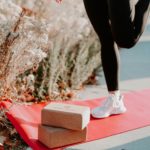 Woman Doing Yoga Using Tapas Original Yoga Mat in Salt Lake City, UT | Santosh Yoga Institute