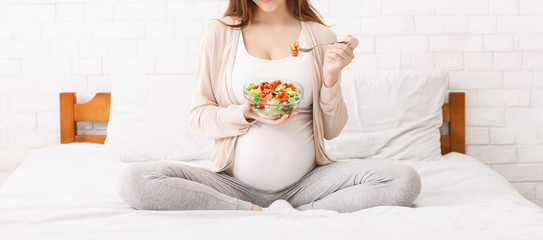 Pregnant woman eating healthy food in Salt Lake City, UT | Santosh Yoga Institute