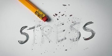 Pencil Stress erased in Savasana pose on the floor in Salt Lake City, UT | Santosh Yoga Institute