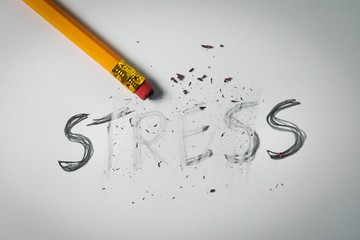 Pencil Stress erased in Savasana pose on the floor in Salt Lake City, UT | Santosh Yoga Institute