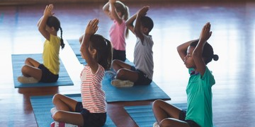 Group of kids practices yoga together in Salt Lake City, UT | Santosh Yoga Institute