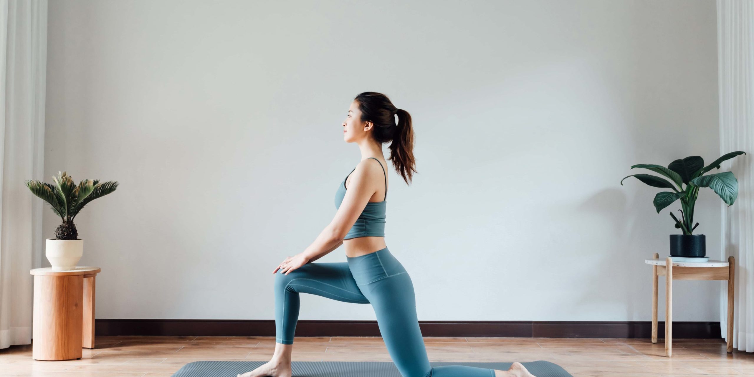 Fit young woman doing yoga in Salt Lake City, UT | Santosh Yoga Institute