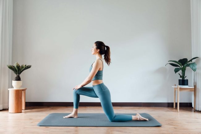 Fit young woman doing yoga in Salt Lake City, UT | Santosh Yoga Institute