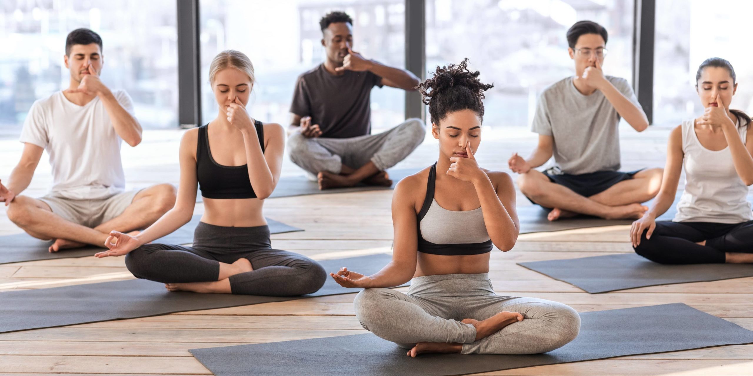 Group of people doing Alternate Nostril Breathing in Salt Lake City, UT | Santosh Yoga Institute