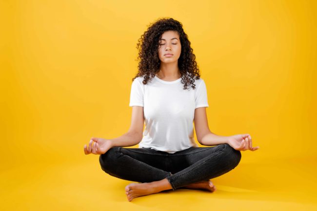 Young girl doing meditation in Salt Lake City, UT | Santosh Yoga Institute