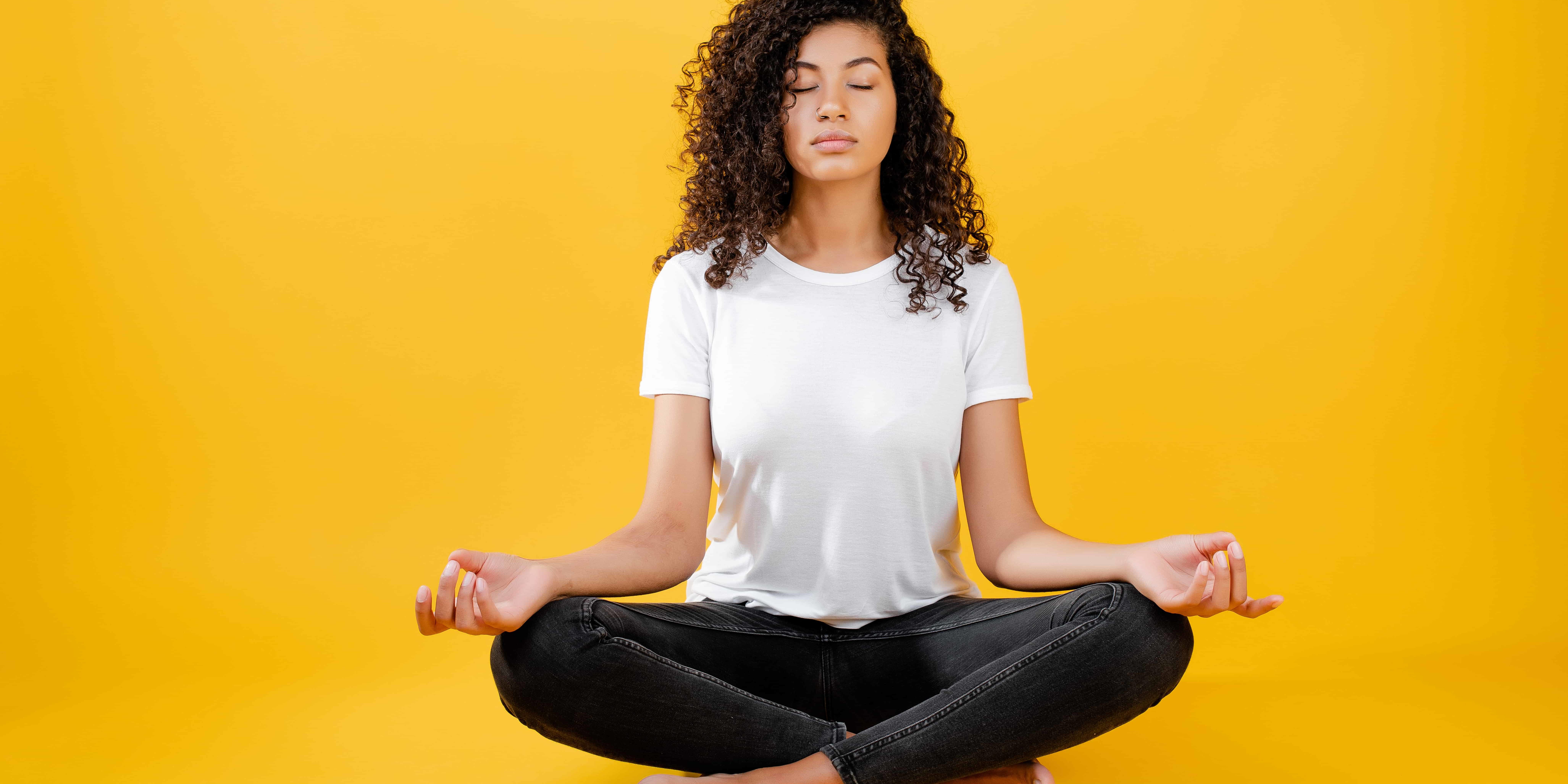 Young girl doing meditation in Salt Lake City, UT | Santosh Yoga Institute