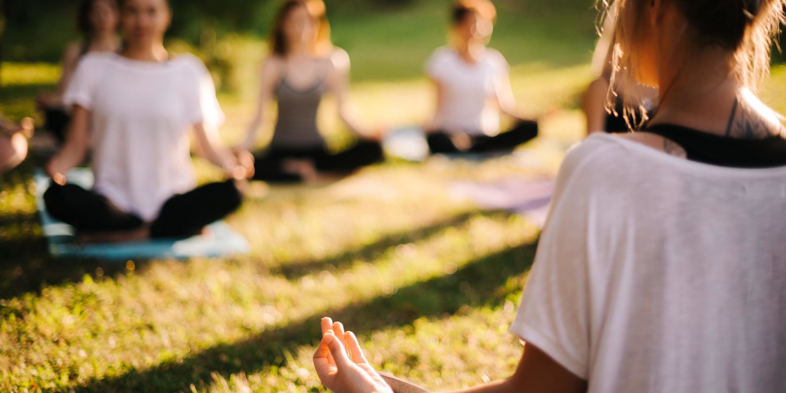 Yoga teacher taking yoga classes outdoors in Salt Lake City, UT | Santosh Yoga Institute