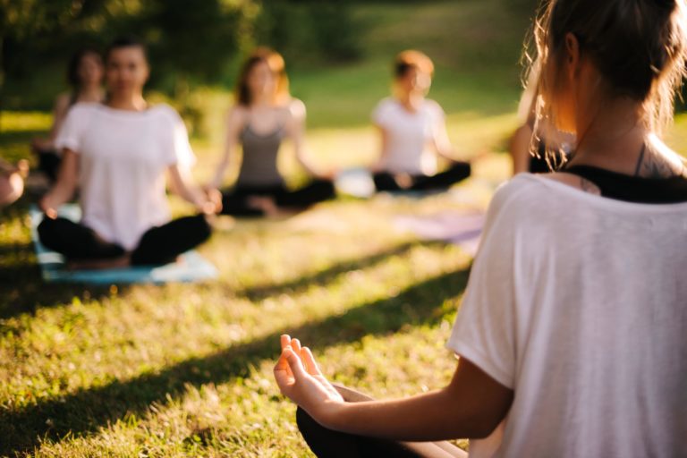 Yoga teacher taking yoga classes outdoors in Salt Lake City, UT | Santosh Yoga Institute